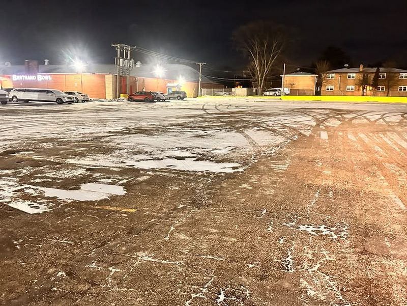 A commercial lot cleared and treated, photographed at night.